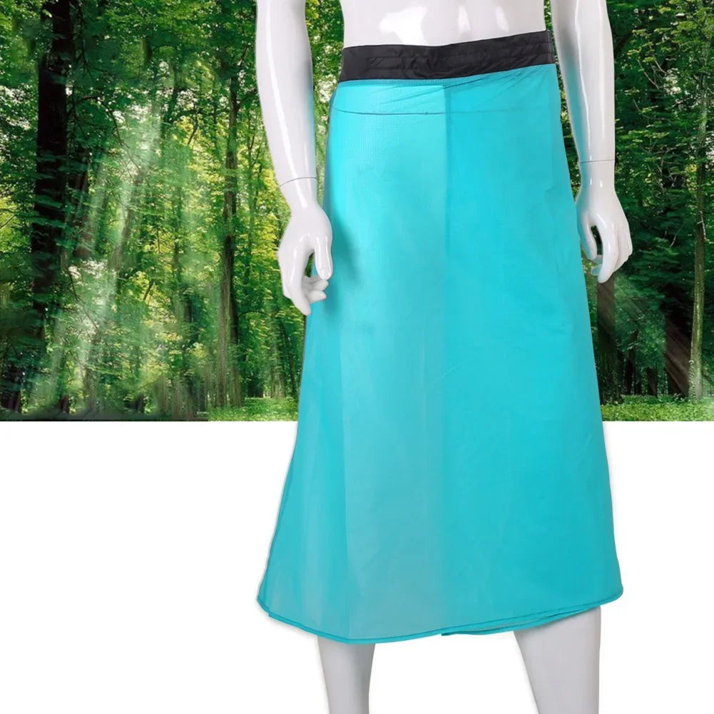 Mannequin wearing a turquoise skirt with a forest background