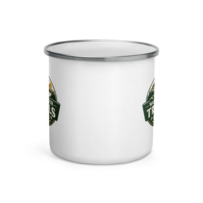 A white enamel camp mug with a silver metal rim, featuring partial green and gold circular mountain-themed graphics on the sides, shown on a clean white background.