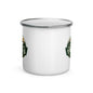 A white enamel camp mug with a silver metal rim, featuring partial green and gold circular mountain-themed graphics on the sides, shown on a clean white background.