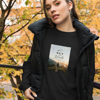 Unisex Long Sleeve Tee, Woman wearing a black jacket with a scenic t-shirt design outdoors in autumn.